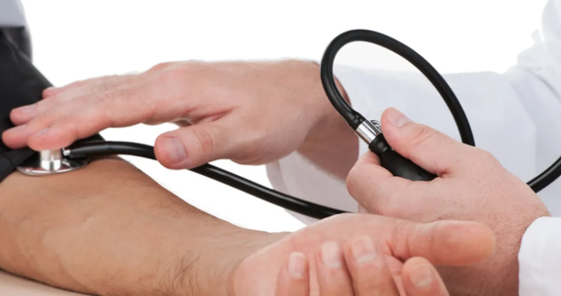 Using a stethoscope to measure someone's blood pressure