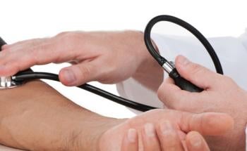 Using a stethoscope to measure someone's blood pressure